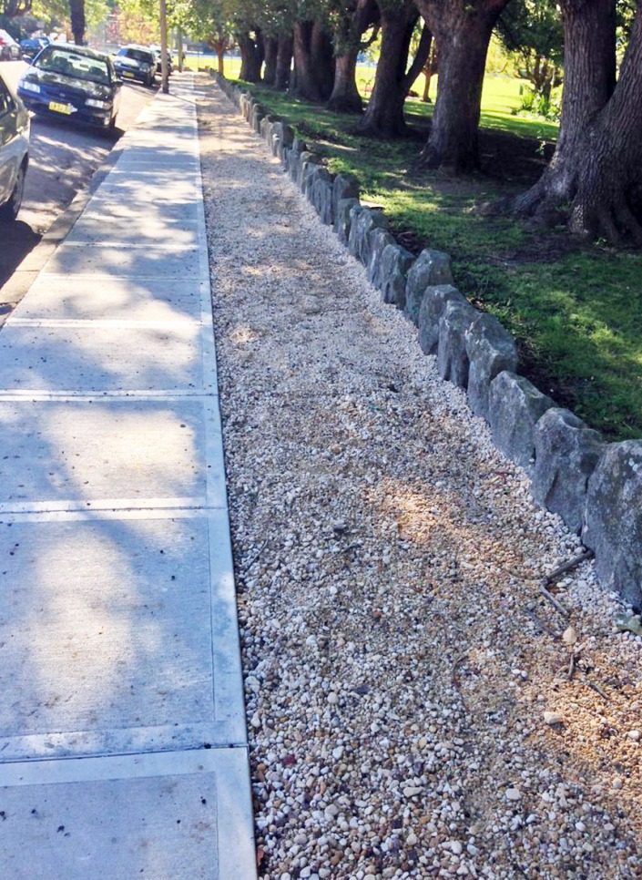 The pavement running alongside Petersham Park: half concrete, half gravel.